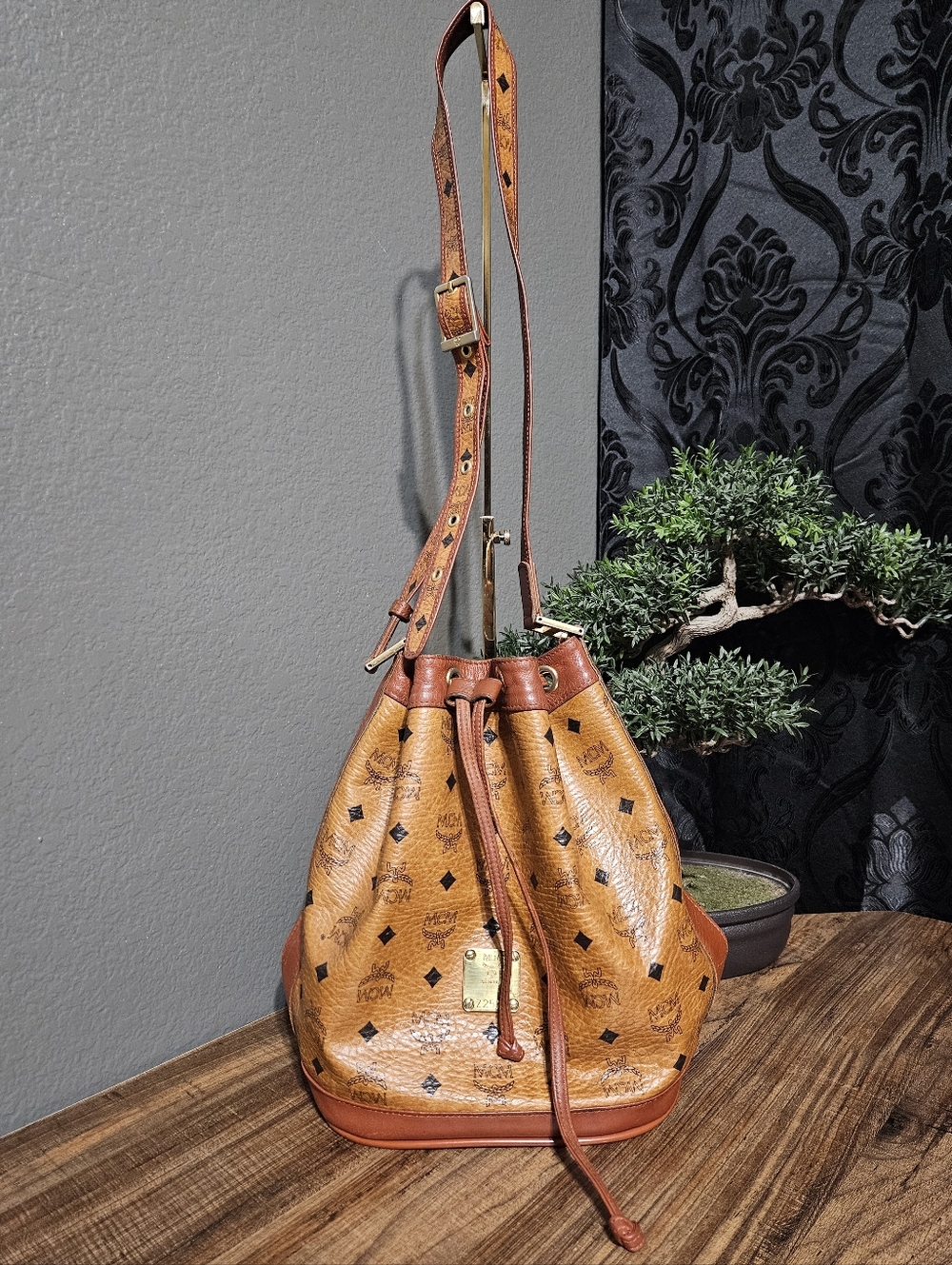 Authentic MCM Cognac Brown Monogram Drawstring Bucket Shoulder Bag